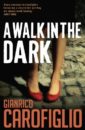 Image of book cover for A Walk in the Dark by Gianrico Carofiglio, image shows a woman's bare legs from the knee down, she is standing andwearing a pair of red court shoes