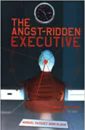 The Angst Ridden Executive book cover showing the back view of a man at a desk, his head in the crosshairs.
