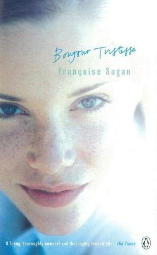 A young woman with a freckled face in close up stares out at the reader